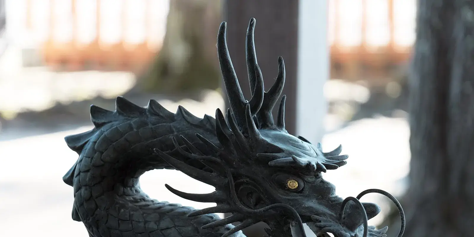 A bronze dragon water spout at the purification fountain (temizuya) of Shirahige Shrine in Takashima, Shiga, Japan
