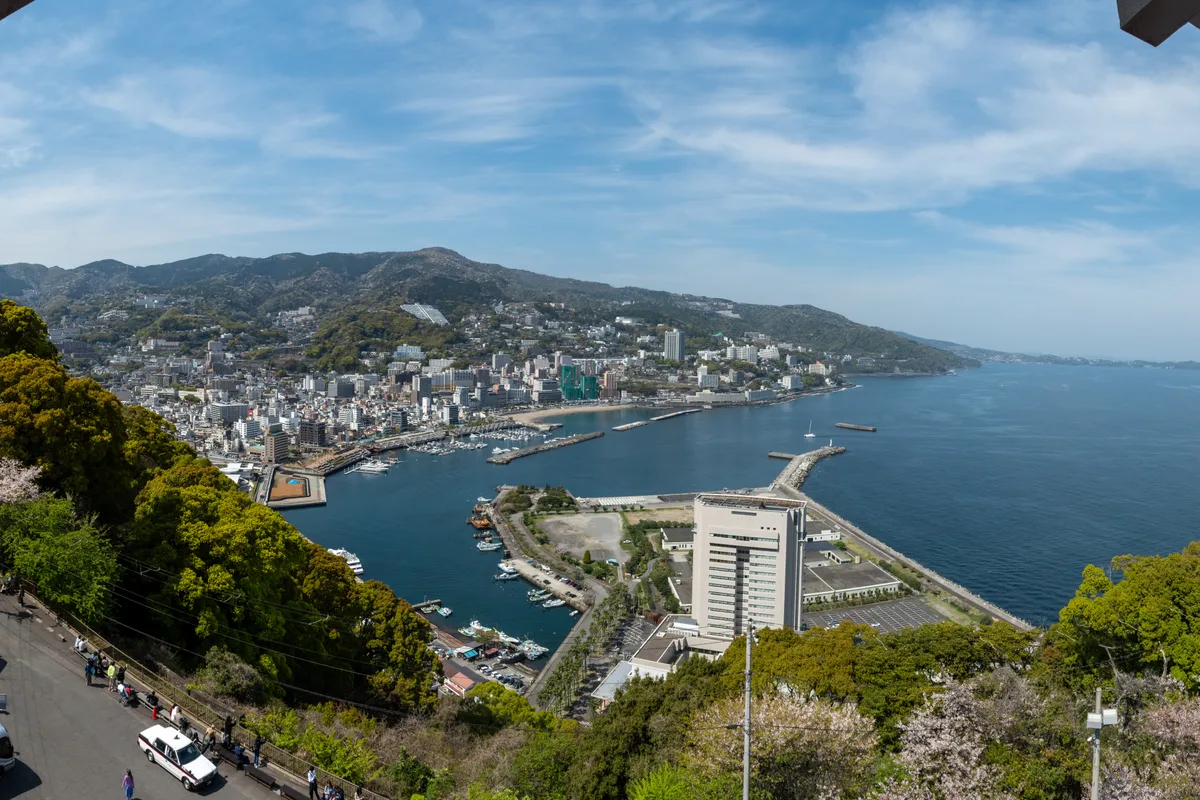 Panoramic sea and cherry blossom view of Atami city and bay, seen from the castle observation deck