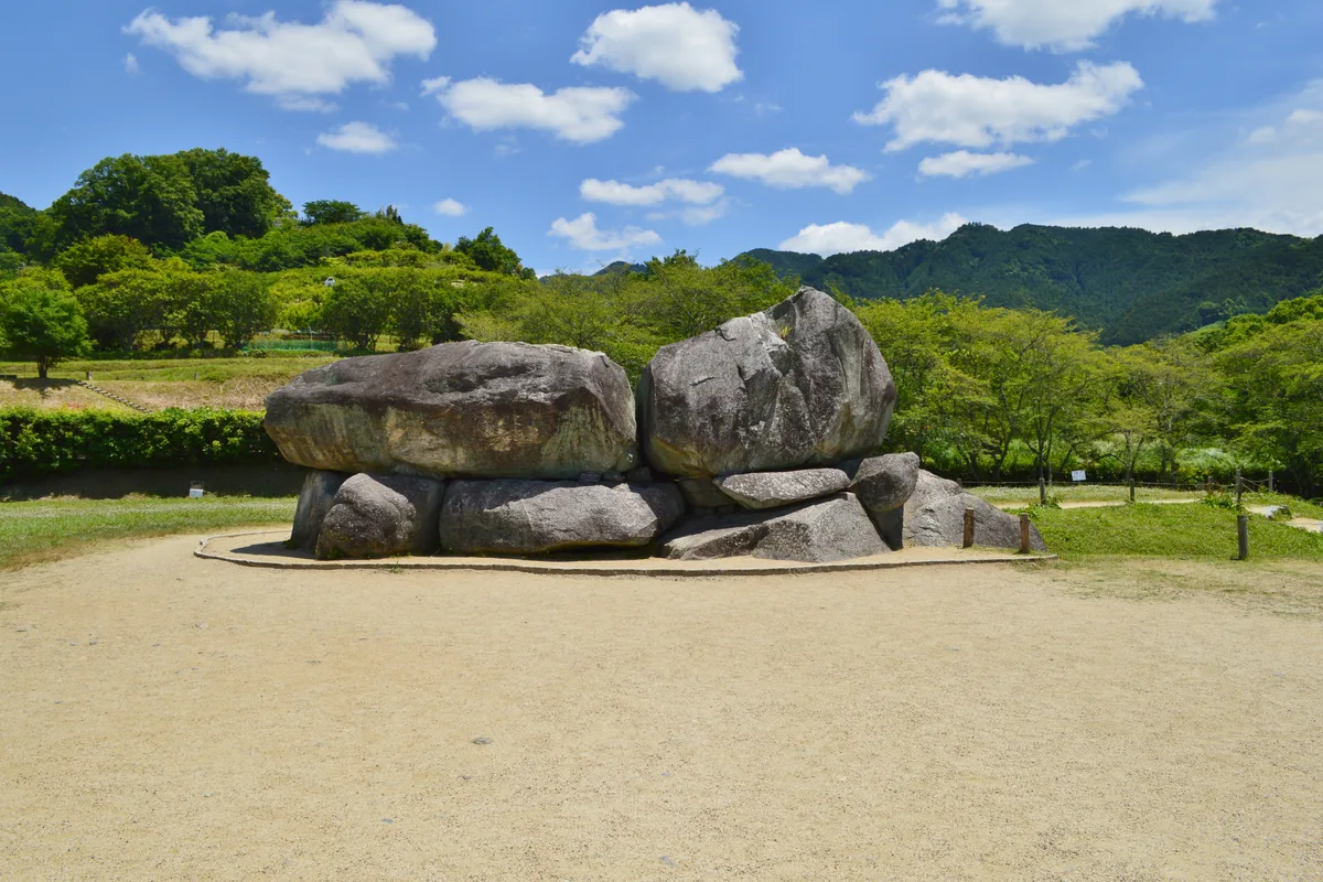 Looking up inside the stone burial chamber of Ishibutai Kofun, showing the massive megaliths forming the ceiling