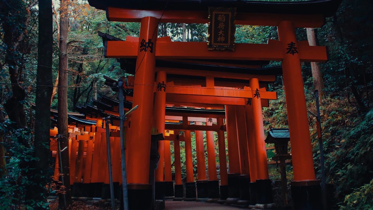 Smaller torii gates and private shrines along the forested mountain path at Fushimi Inari