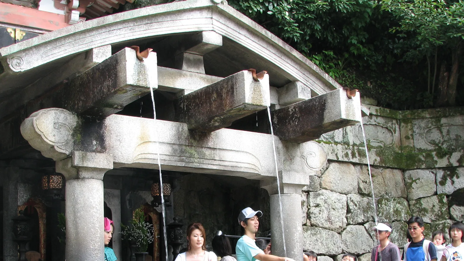 The three streams of the Otowa Waterfall, where visitors catch the pure water in long-handled ladles