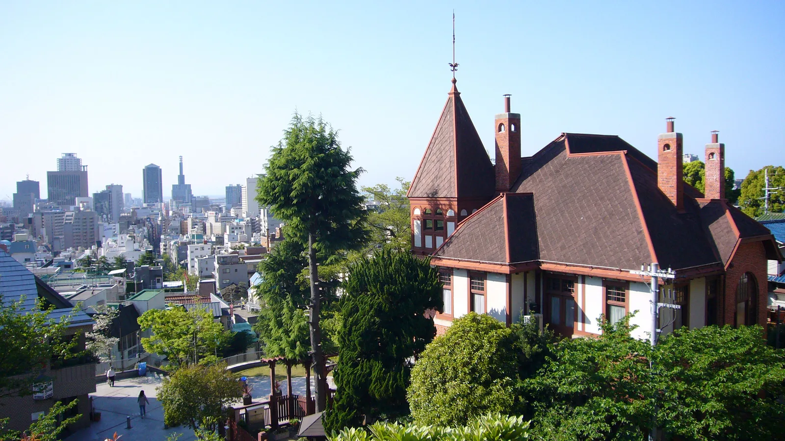 The red-brick Weathercock House on the Kitano hillside, one of Kobe's preserved ijinkan foreign residences, with the city and the sea spread out below