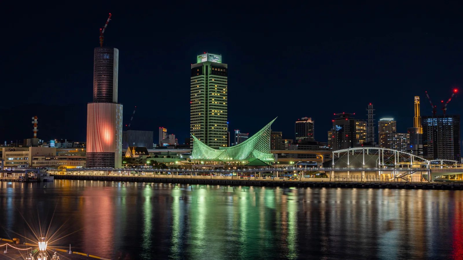 Kobe Port Tower and the waterfront at Meriken Park, with the red lattice tower standing over the harbor