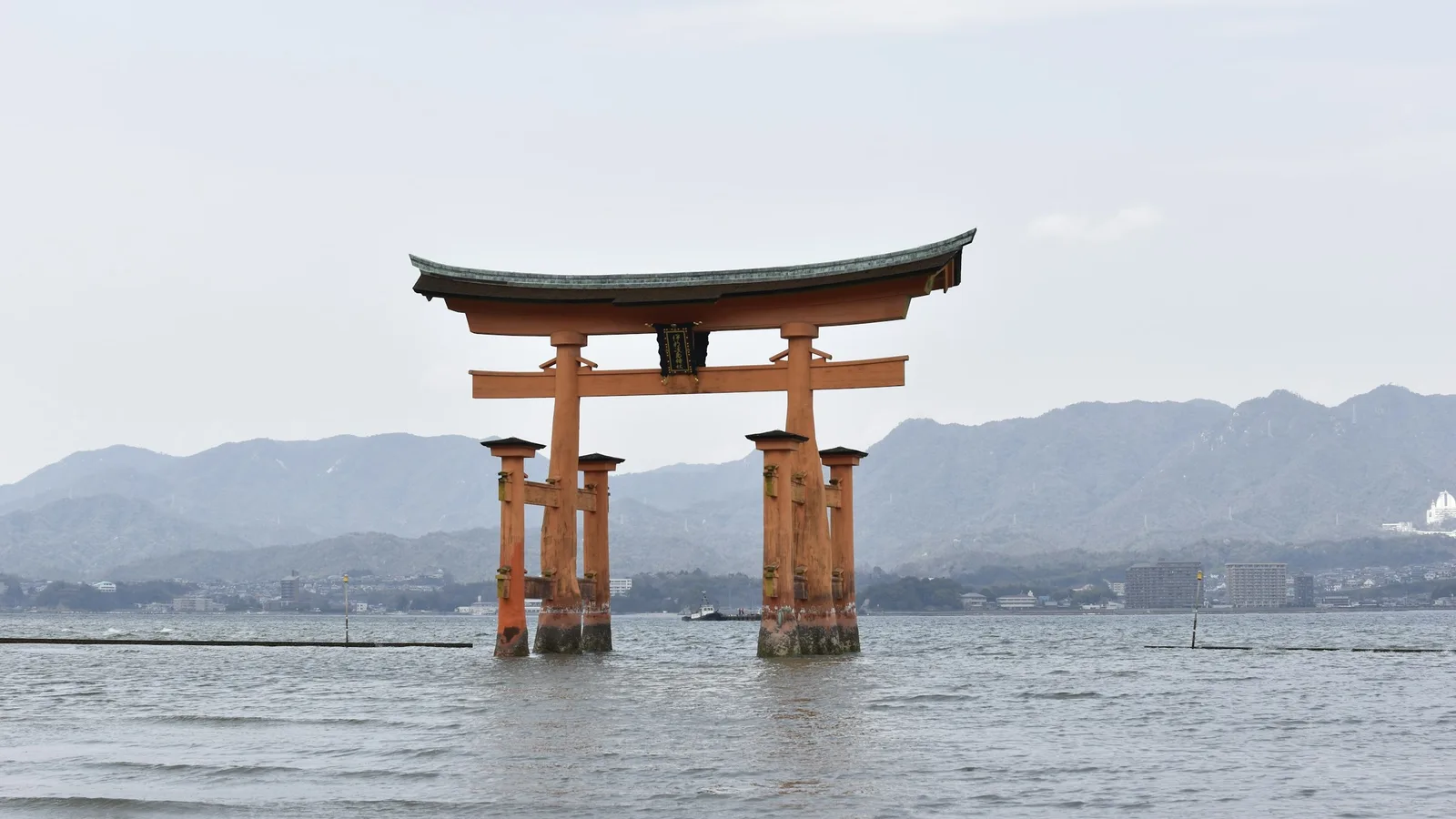 The great torii gate of Itsukushima Shrine standing in the sea off Miyajima