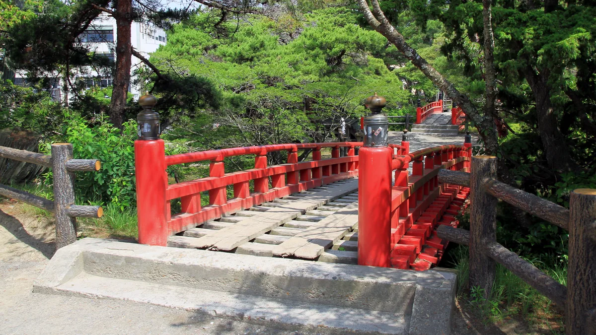 The red Sukashibashi bridge leading to Godaido hall on its islet in Matsushima Bay
