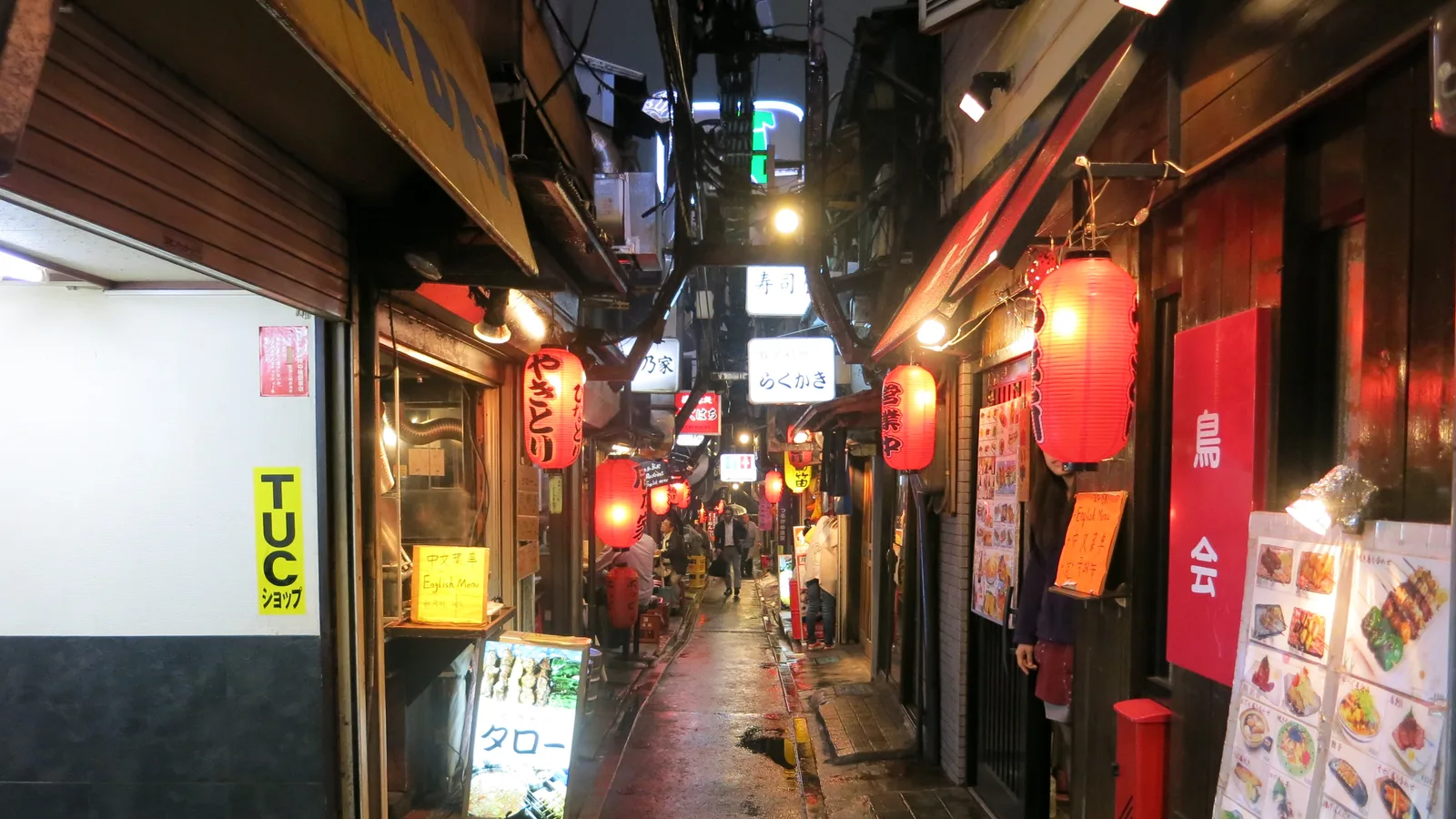 The red lanterns and narrow lane of Omoide Yokocho at night in Shinjuku