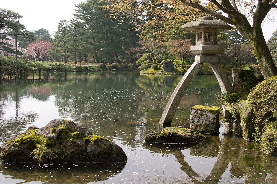 The two-legged Kotoji stone lantern beside the pond at Kenrokuen garden, Kanazawa