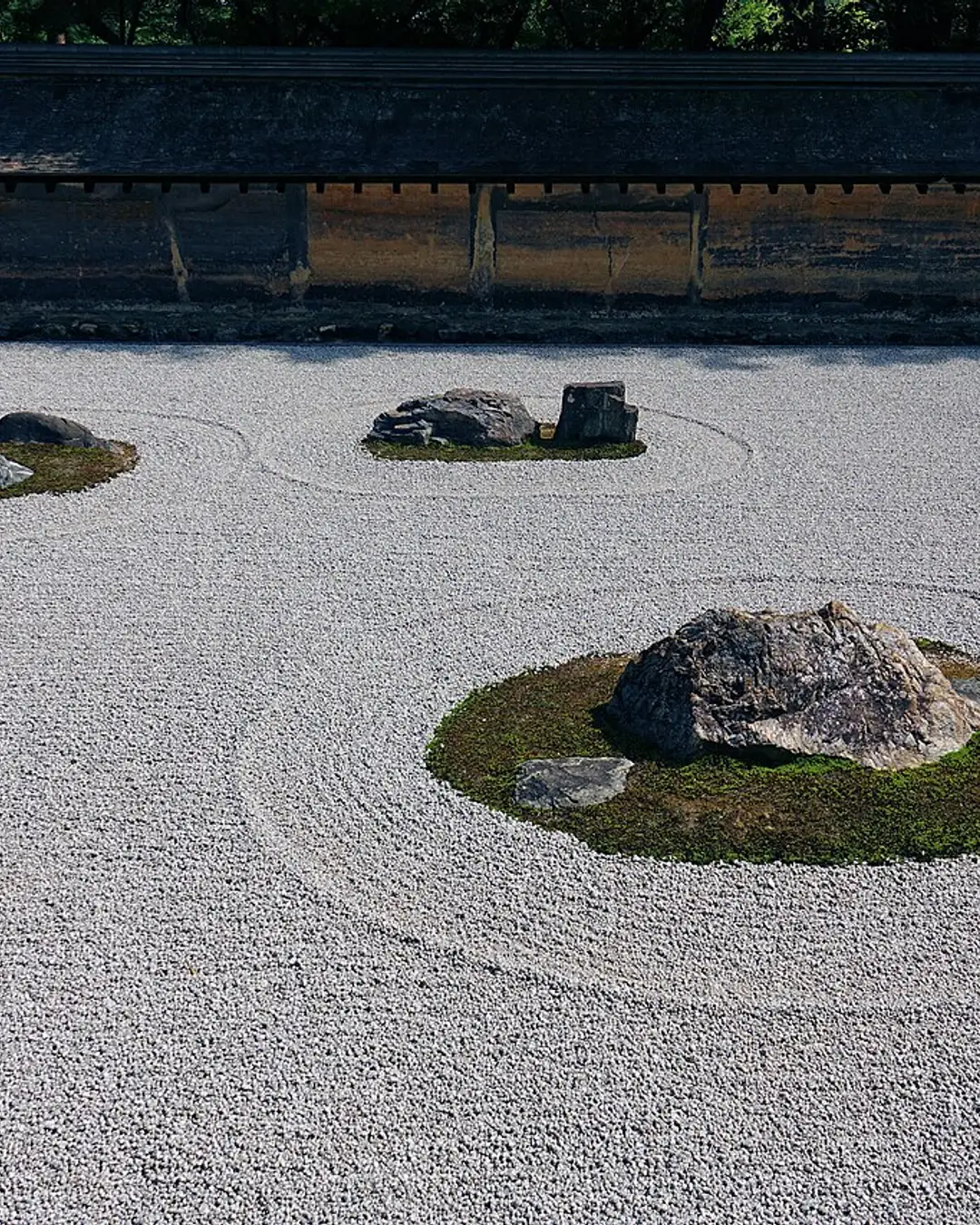 The empty raked-gravel rock garden at Ryoan-ji, Kyoto