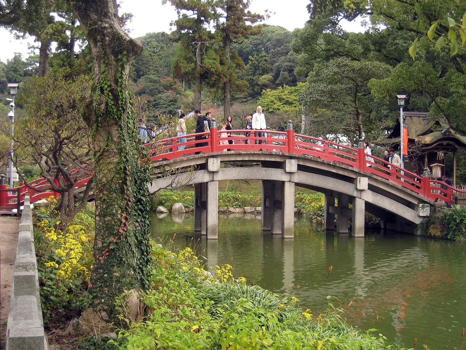 The vermilion arched bridge over the pond at Dazaifu Tenmangu shrine near Fukuoka