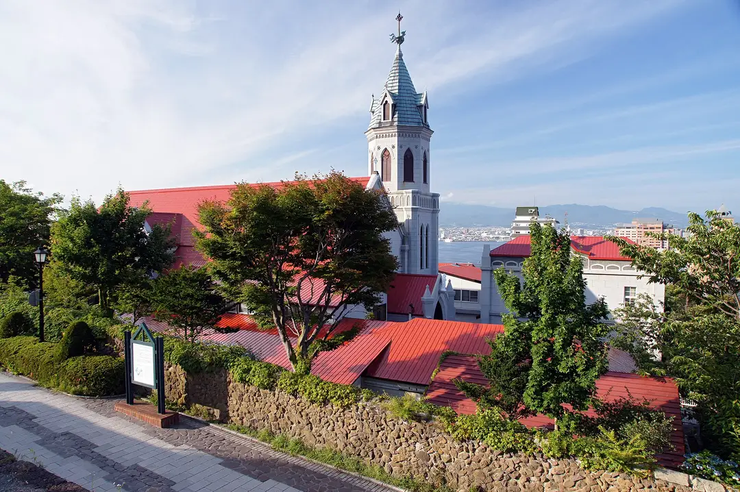 The red-roofed spire of Motomachi Catholic Church in Hakodate, overlooking the bay