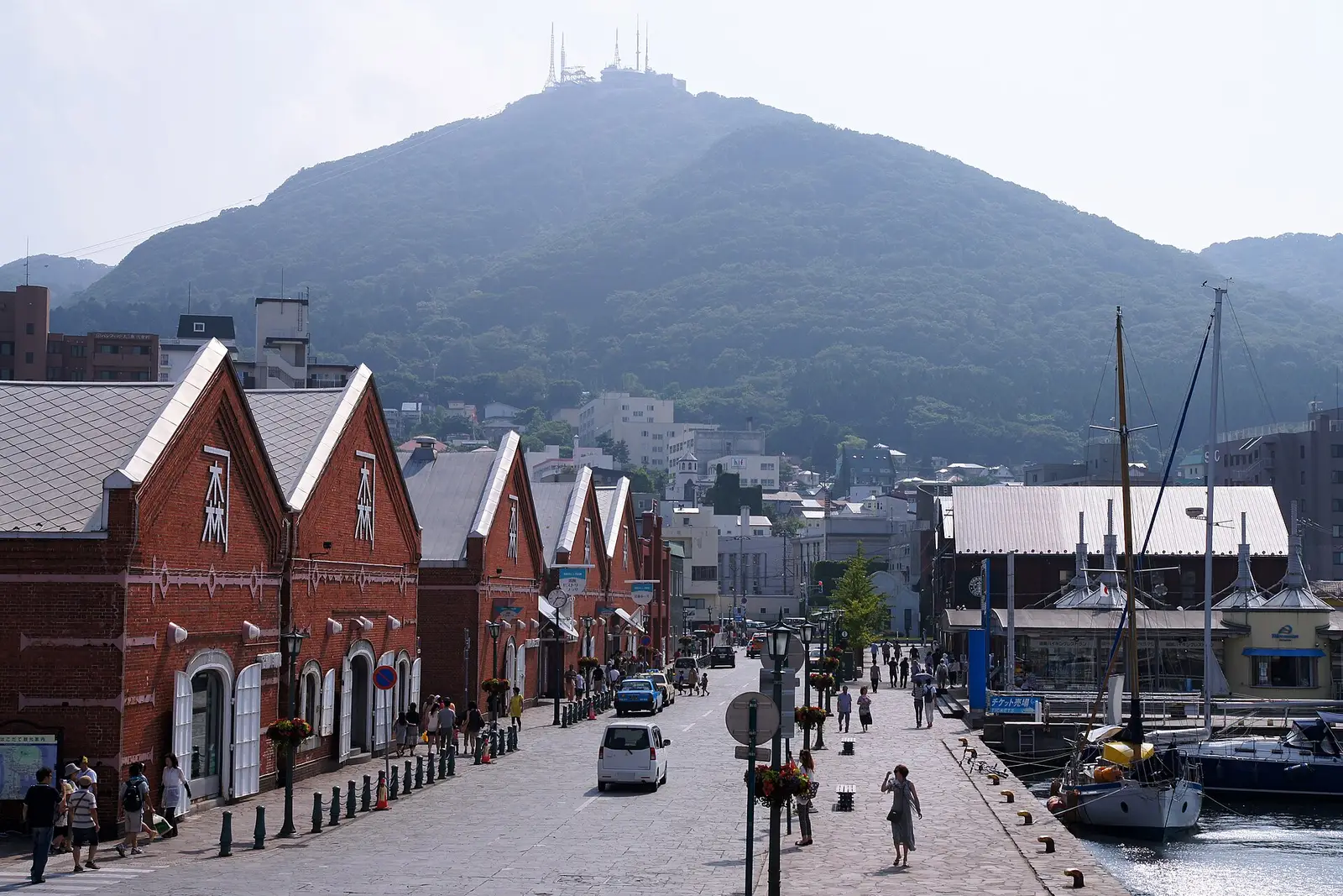 Hakodate's red-brick trading warehouses along the harbor, with Mount Hakodate rising behind