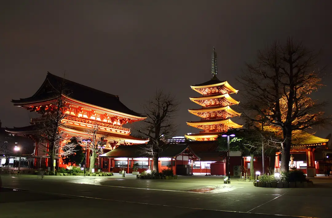 Senso-ji temple and its five-story pagoda lit up at night in Asakusa, Tokyo